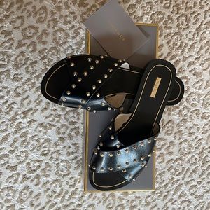 Louise et Cie Black leather flat sandals with gold studs